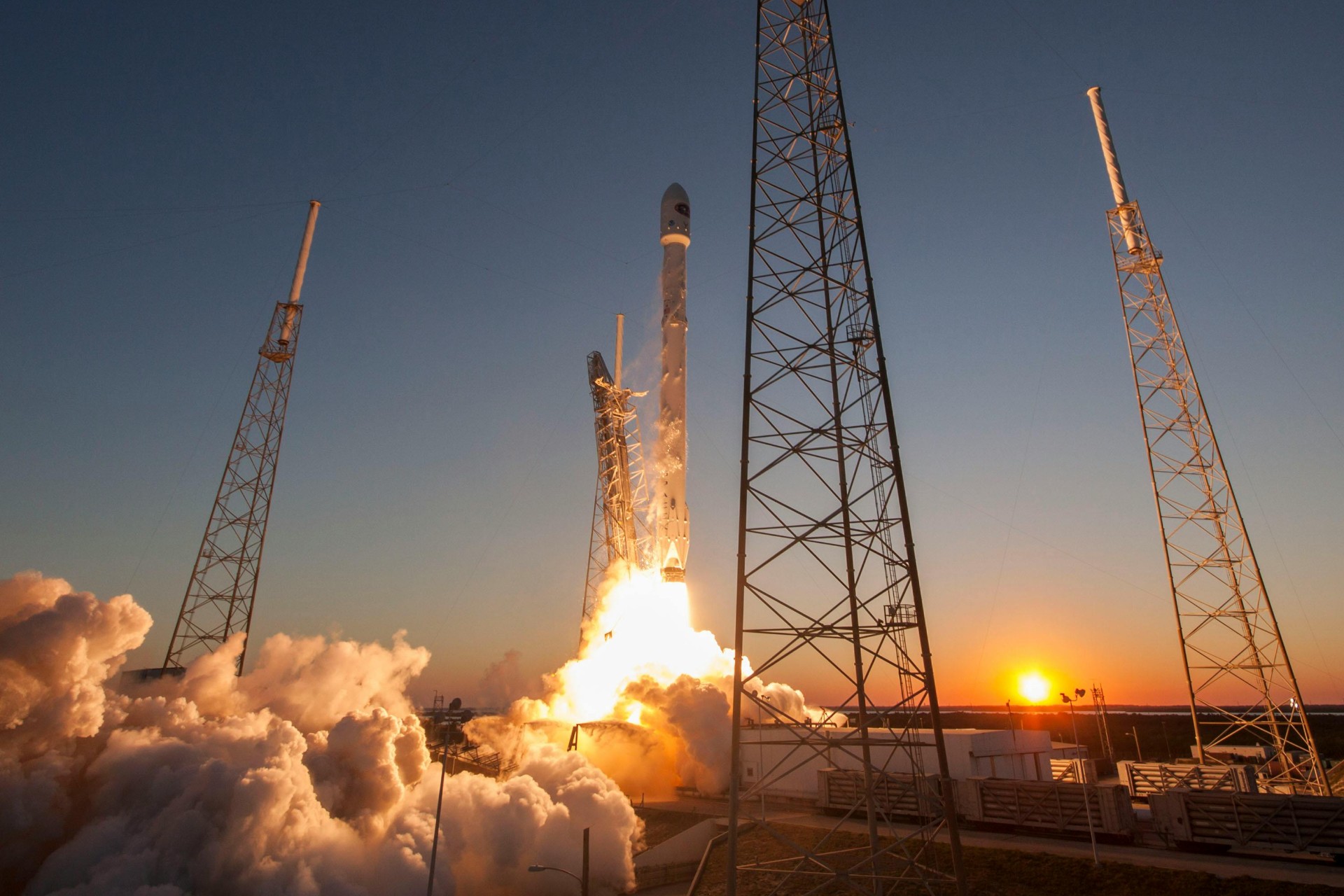 SpaceX Starship rocket launching against a night sky